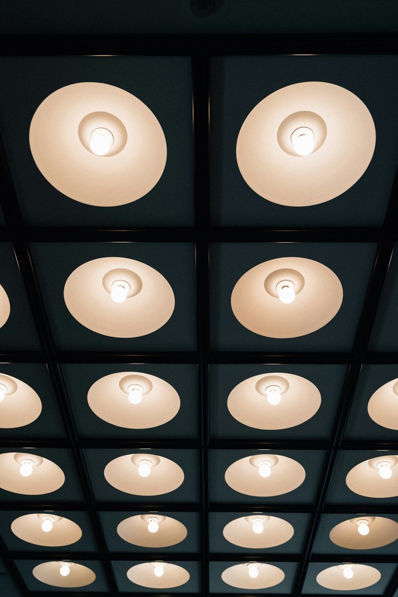 A grid of soft, glowing pendant lights