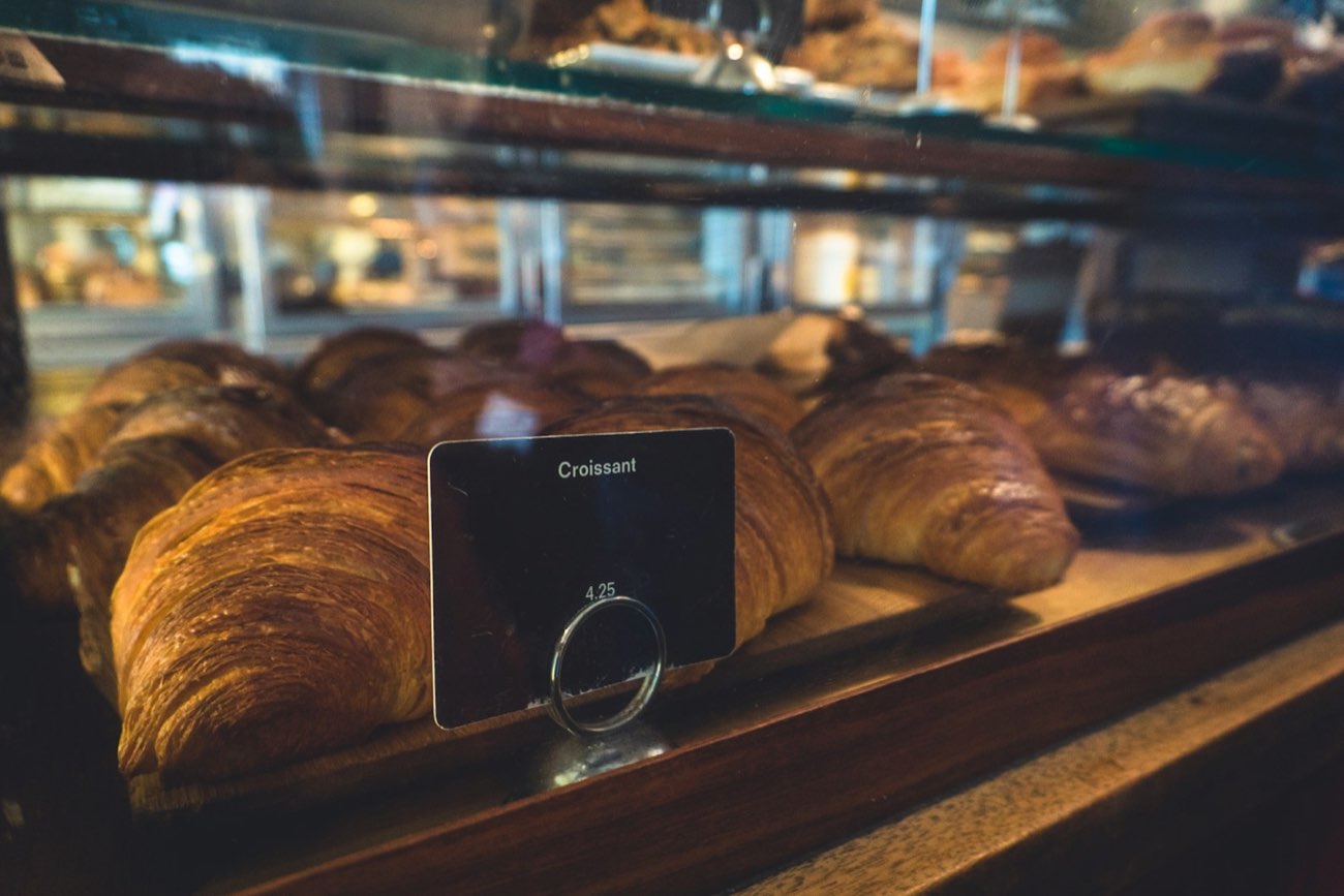 Fresh croissants in a bakery display