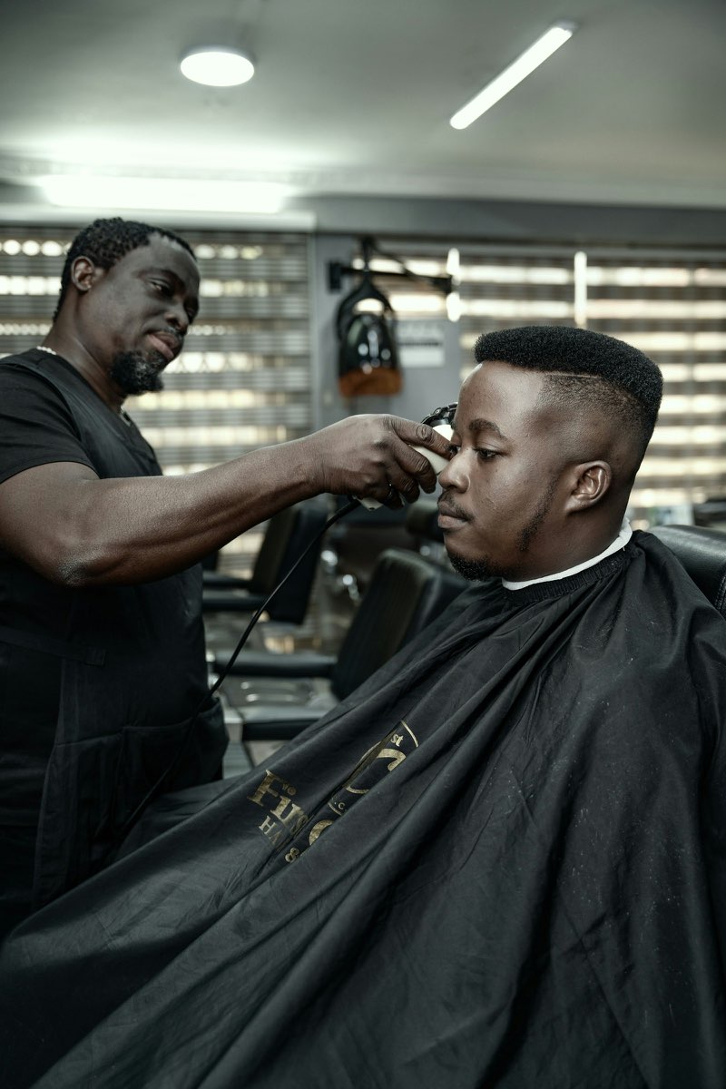 A barber working a clean fade