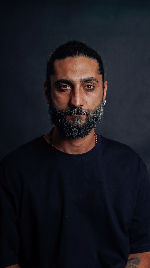 Portrait of a bearded man in a dark studio — example imagery