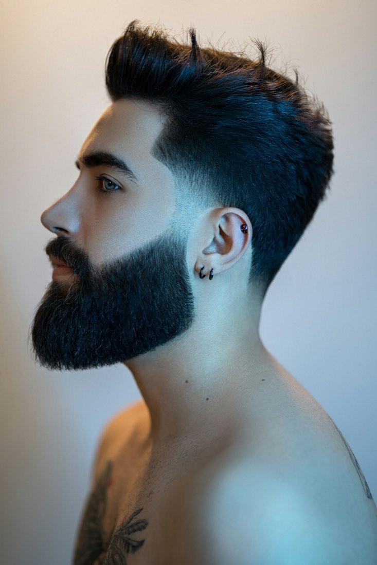 A sharp men's cut and beard, profile